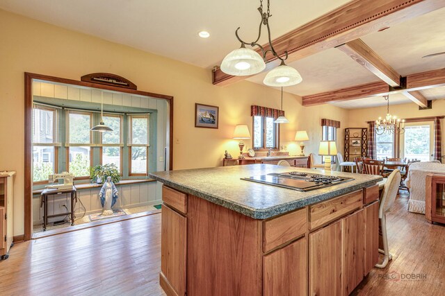 3206 Turnberry Dr, Mchenry, IL 60050 - kitchen with electric cooktop, beam ceiling, wood finished floors, a chandelier, and a center island