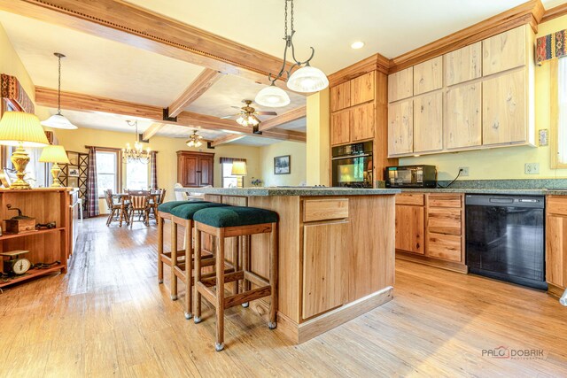 3206 Turnberry Dr, Mchenry, IL 60050 - kitchen with black appliances, light wood-style flooring, light brown cabinetry, a breakfast bar, and ceiling fan