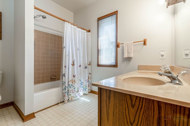 3206 Turnberry Dr, Mchenry, IL 60050 - bathroom featuring toilet, vanity, shower / bath combo with shower curtain, and baseboards