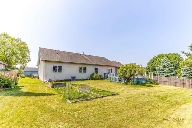 3206 Turnberry Dr, Mchenry, IL 60050 - rear view of property featuring a garden and central air condition unit