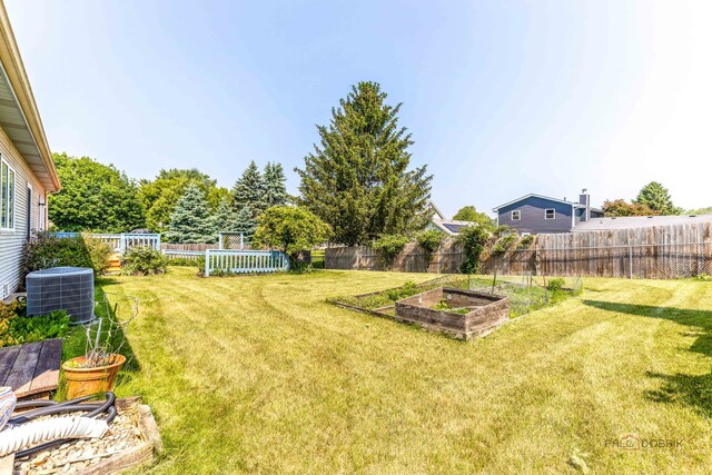 3206 Turnberry Dr, Mchenry, IL 60050 - view of yard featuring central AC and a garden