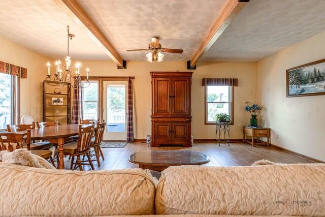3206 Turnberry Dr, Mchenry, IL 60050 - living area featuring plenty of natural light, wood finished floors, a chandelier, and beamed ceiling