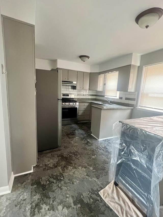 1100 Hannah Ave Unit 104, Forest Park, IL 60130 - kitchen with appliances with stainless steel finishes, gray cabinetry, decorative backsplash, extractor fan, and a peninsula
