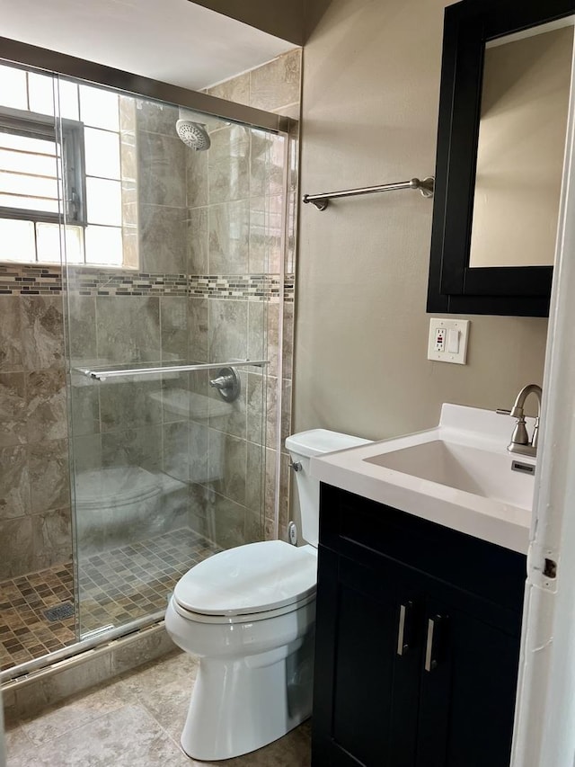 1100 Hannah Ave Unit 104, Forest Park, IL 60130 - bathroom featuring toilet, vanity, and a shower stall
