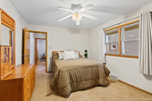 9544 S Avers Ave, Evergreen Park, IL 60805 - bedroom featuring light carpet, baseboards, and a ceiling fan