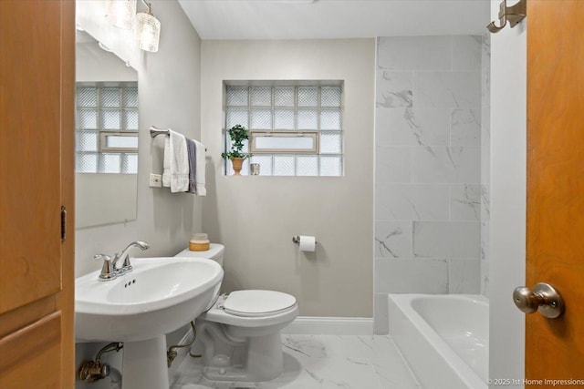 9544 S Avers Ave, Evergreen Park, IL 60805 - bathroom featuring marble look tiles, toilet, and baseboards