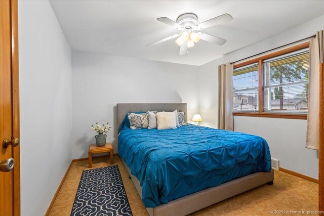 9544 S Avers Ave, Evergreen Park, IL 60805 - bedroom with carpet floors, baseboards, and ceiling fan