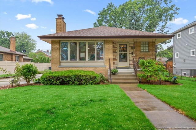 9544 S Avers Ave, Evergreen Park, IL 60805 - bungalow-style home with brick siding, a chimney, central AC unit, and covered porch