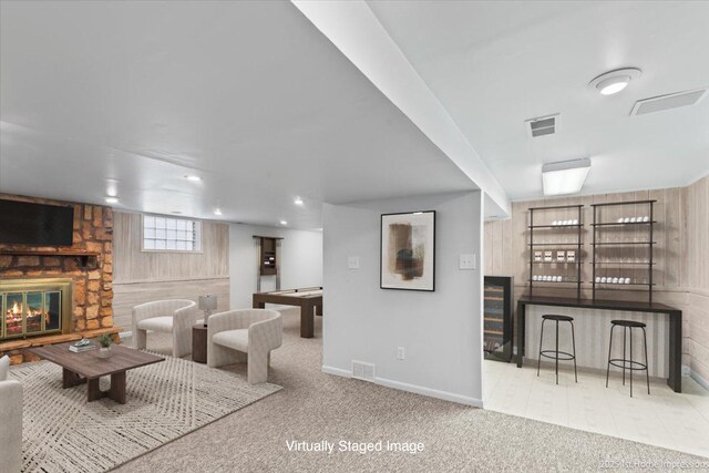 9544 S Avers Ave, Evergreen Park, IL 60805 - living area featuring a stone fireplace, baseboards, carpet floors, and wood walls
