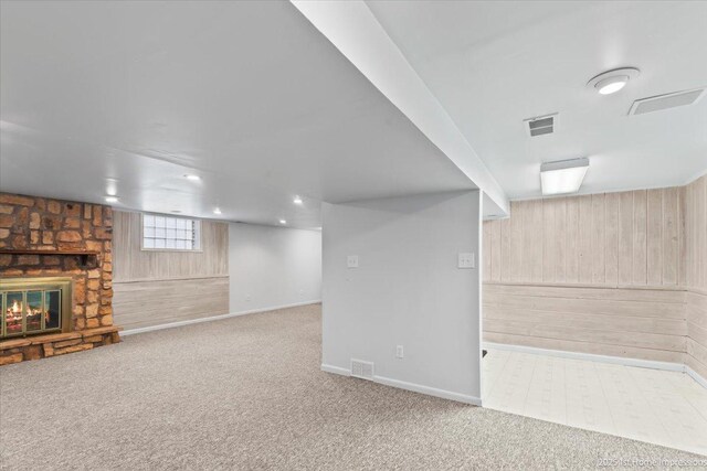 9544 S Avers Ave, Evergreen Park, IL 60805 - basement with wooden walls, carpet, a fireplace, and baseboards