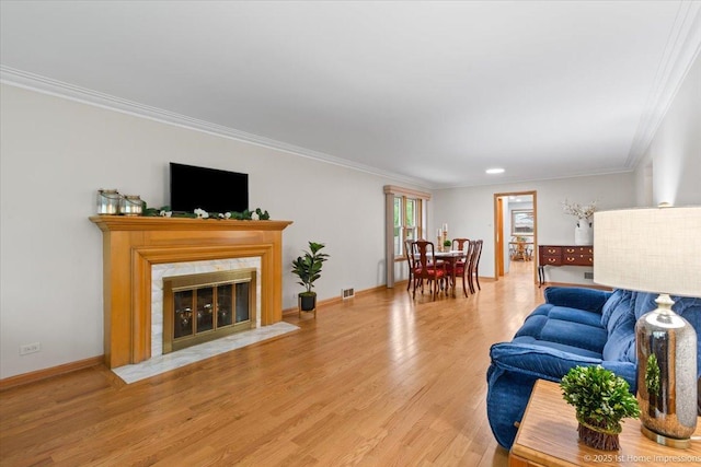 9544 S Avers Ave, Evergreen Park, IL 60805 - living area featuring crown molding, light wood-style flooring, baseboards, and a high end fireplace