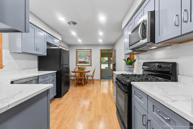 9544 S Avers Ave, Evergreen Park, IL 60805 - kitchen featuring black appliances, backsplash, light wood-type flooring, gray cabinetry, and recessed lighting