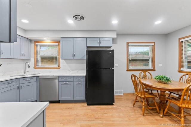9544 S Avers Ave, Evergreen Park, IL 60805 - kitchen featuring freestanding refrigerator, dishwasher, a sink, gray cabinets, and light countertops