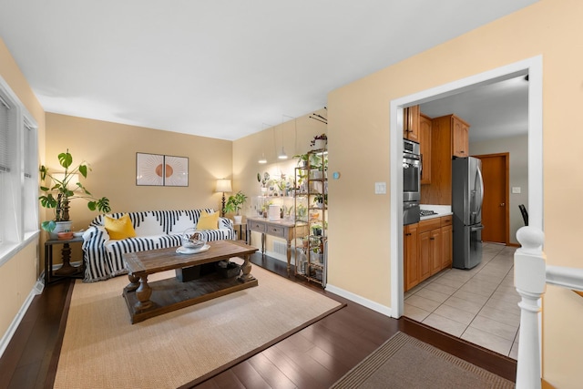 5111 S Luna Ave, Chicago, IL 60638 - living room featuring light wood-type flooring and baseboards