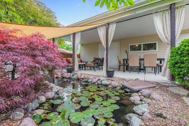 5111 S Luna Ave, Chicago, IL 60638 - view of patio / terrace with a small pond