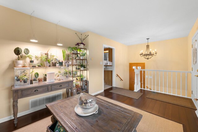 5111 S Luna Ave, Chicago, IL 60638 - dining room with a chandelier, wood finished floors, and baseboards