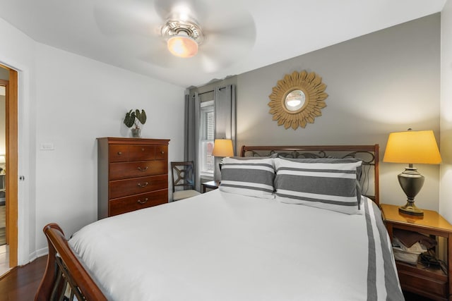 5111 S Luna Ave, Chicago, IL 60638 - bedroom featuring dark wood-type flooring, ceiling fan, and baseboards