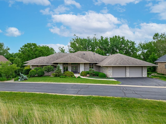 515 Stone Ridge Ln, Cherry Valley, IL 61016 - single story home featuring a garage, driveway, a front lawn, roof with shingles, and brick siding