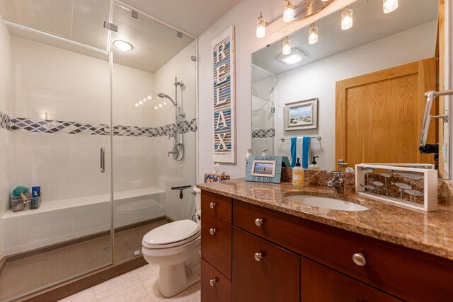 515 Stone Ridge Ln, Cherry Valley, IL 61016 - bathroom featuring tile patterned flooring, a stall shower, and vanity