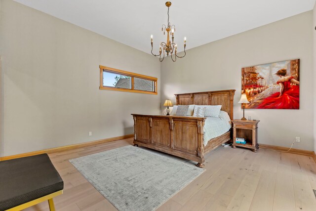 515 Stone Ridge Ln, Cherry Valley, IL 61016 - bedroom featuring a chandelier and light wood-style floors