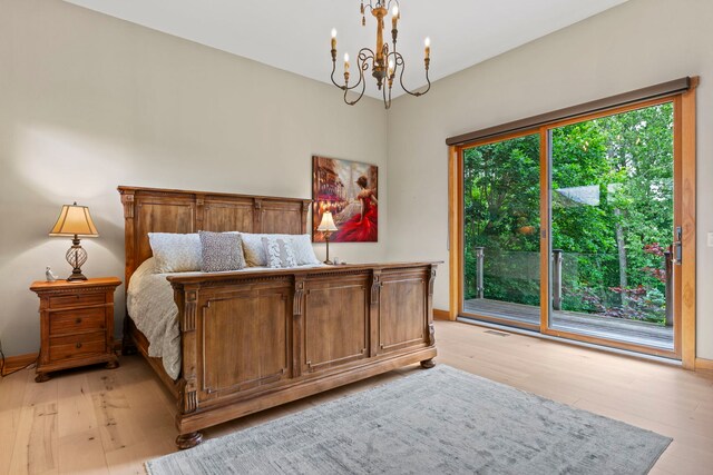 515 Stone Ridge Ln, Cherry Valley, IL 61016 - bedroom with access to outside, a chandelier, and light wood-style floors