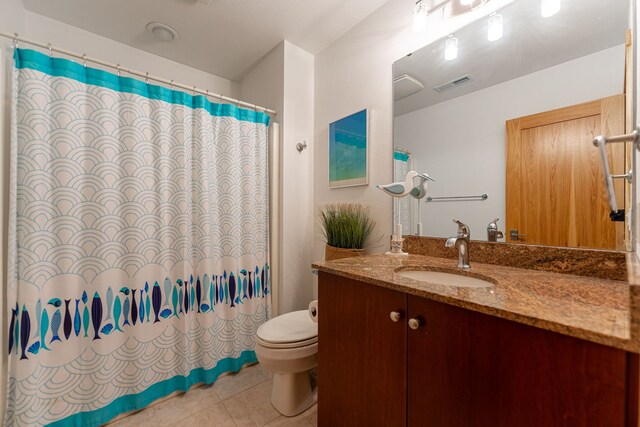 515 Stone Ridge Ln, Cherry Valley, IL 61016 - full bath featuring vanity, tile patterned floors, and a shower with shower curtain