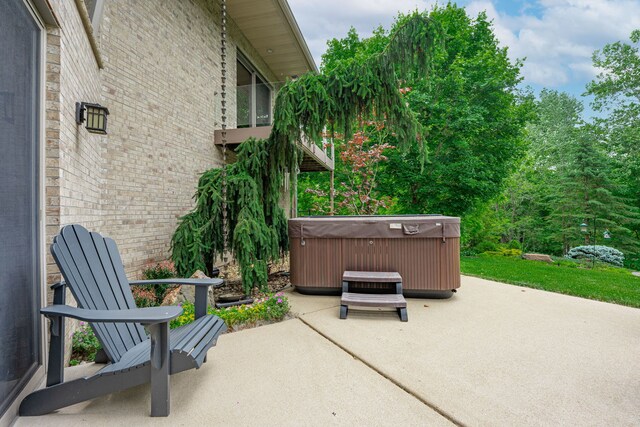 515 Stone Ridge Ln, Cherry Valley, IL 61016 - view of patio / terrace with a hot tub