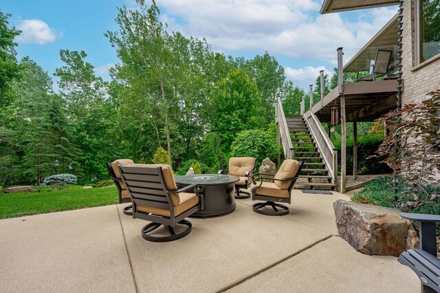515 Stone Ridge Ln, Cherry Valley, IL 61016 - view of patio featuring stairway and a fire pit