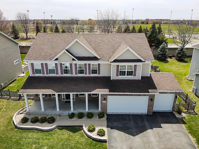 3740 Ryder Ct, Naperville, IL 60564 - view of front of property with asphalt driveway, roof with shingles, a porch, and brick siding