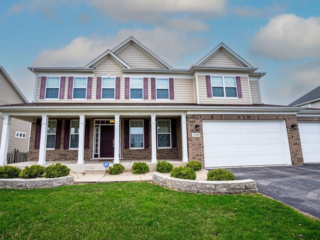 3740 Ryder Ct, Naperville, IL 60564 - view of front of property with brick siding, asphalt driveway, covered porch, a front lawn, and an attached garage