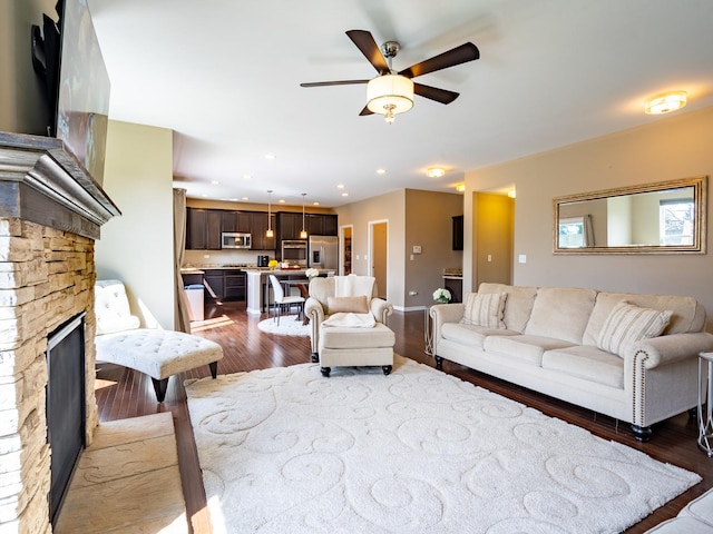 3740 Ryder Ct, Naperville, IL 60564 - living area with a stone fireplace, wood finished floors, a ceiling fan, and recessed lighting