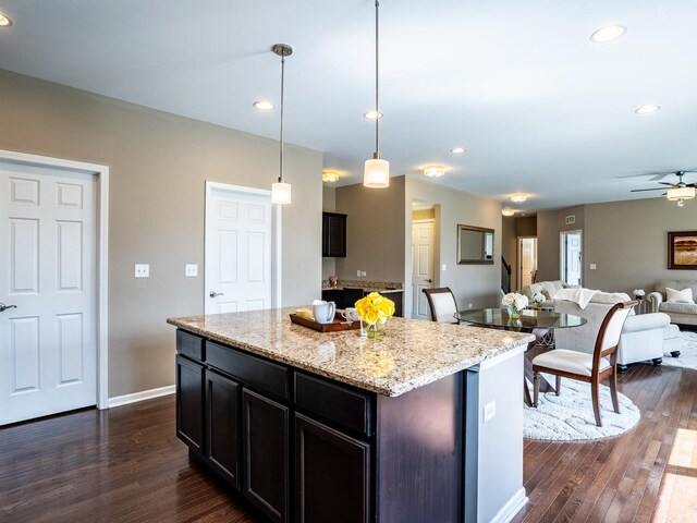 3740 Ryder Ct, Naperville, IL 60564 - kitchen featuring dark wood finished floors, ceiling fan, open floor plan, recessed lighting, and light stone counters