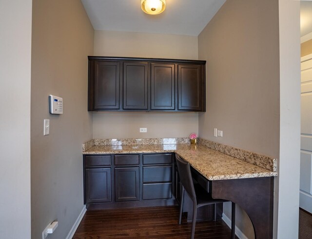 3740 Ryder Ct, Naperville, IL 60564 - kitchen with dark brown cabinets, dark wood finished floors, light stone countertops, and baseboards
