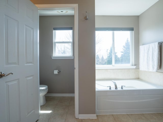 3740 Ryder Ct, Naperville, IL 60564 - full bathroom with healthy amount of natural light, toilet, a garden tub, and tile patterned floors
