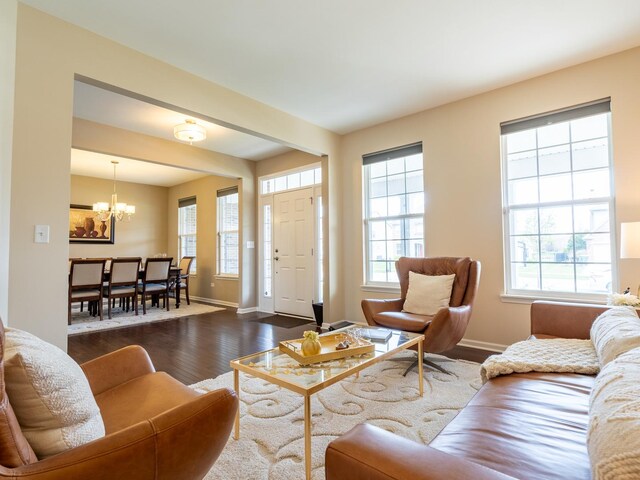 3740 Ryder Ct, Naperville, IL 60564 - living room featuring dark wood-style flooring, baseboards, and a chandelier