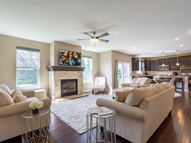 3740 Ryder Ct, Naperville, IL 60564 - living room with dark wood-style floors, a ceiling fan, recessed lighting, a fireplace, and baseboards