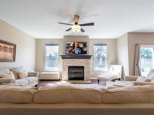 3740 Ryder Ct, Naperville, IL 60564 - living area with healthy amount of natural light, ceiling fan, a stone fireplace, and wood finished floors