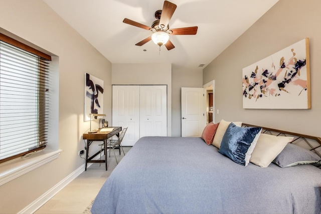 4950 N Western Ave Unit 101, Chicago, IL 60625 - bedroom featuring a closet, baseboards, ceiling fan, and light wood finished floors