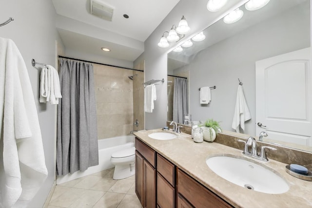 4950 N Western Ave Unit 101, Chicago, IL 60625 - full bathroom featuring tile patterned flooring, double vanity, shower / bath combo with shower curtain, and toilet