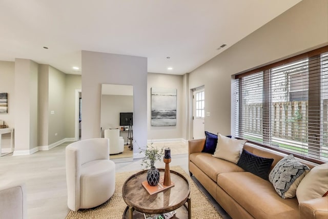 4950 N Western Ave Unit 101, Chicago, IL 60625 - living room with recessed lighting, baseboards, and light wood-style floors