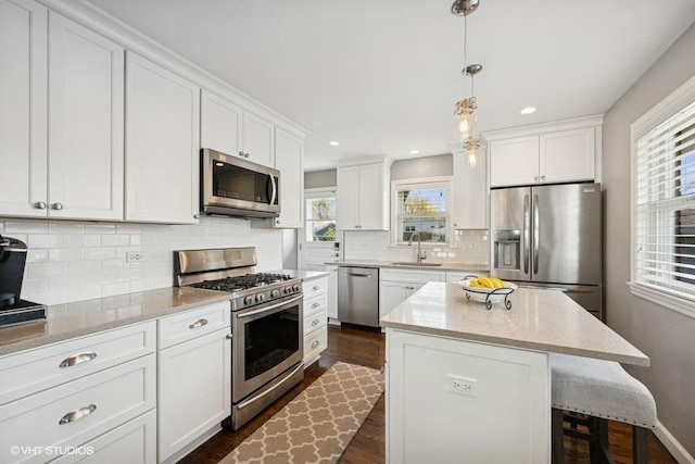 907 N Wilshire Ln, Arlington Heights, IL 60004 - kitchen featuring appliances with stainless steel finishes, a sink, plenty of natural light, dark wood-type flooring, and recessed lighting
