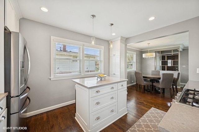 907 N Wilshire Ln, Arlington Heights, IL 60004 - kitchen featuring stainless steel fridge, light countertops, baseboards, white cabinetry, and hanging light fixtures
