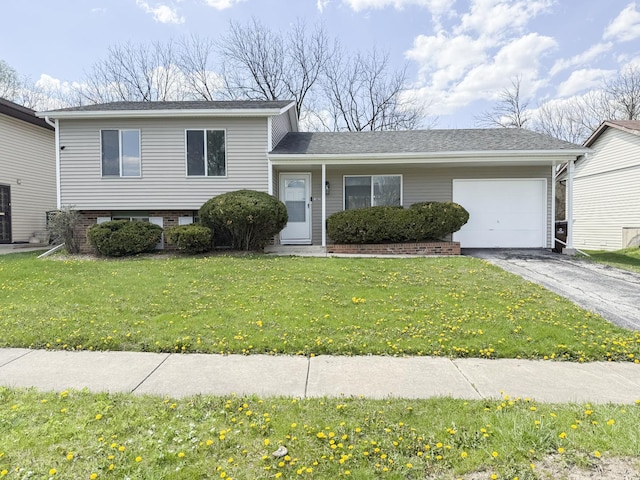 18200 Fountainbleau Dr, Hazel Crest, IL 60429 - tri-level home with a garage, asphalt driveway, and a front yard