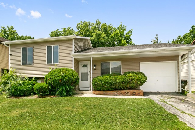 18200 Fountainbleau Dr, Hazel Crest, IL 60429 - tri-level home with asphalt driveway, an attached garage, and a front yard