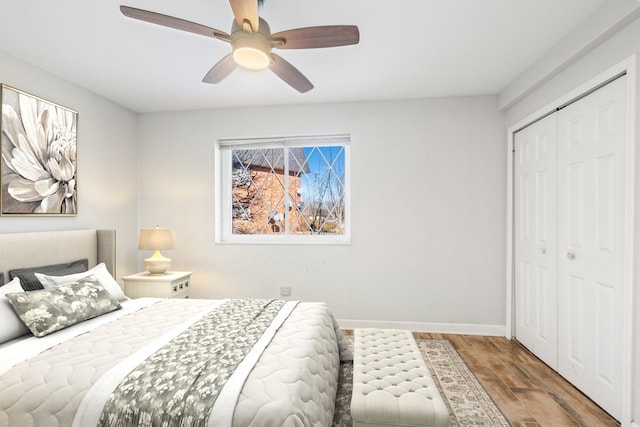 17220 71st Ave Unit 2, Tinley Park, IL 60477 - bedroom featuring wood finished floors, a closet, baseboards, and a ceiling fan
