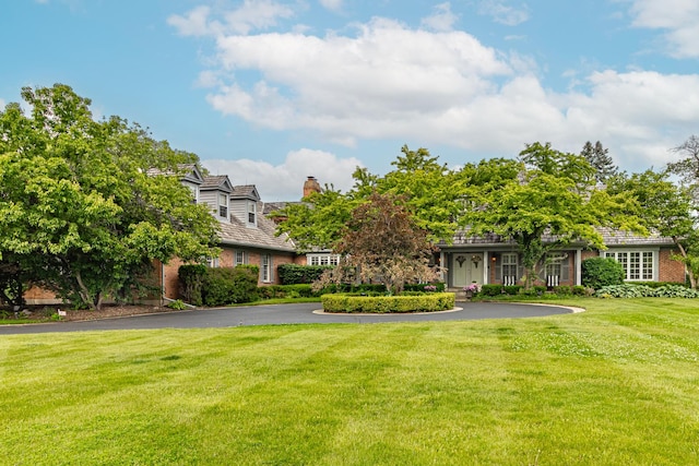 36955 N Fox Hill Dr, Wadsworth, IL 60083 - view of front of property featuring a chimney, a front lawn, and brick siding