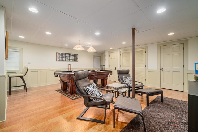 36955 N Fox Hill Dr, Wadsworth, IL 60083 - living room featuring a drop ceiling, light wood-type flooring, billiards, wainscoting, and a decorative wall