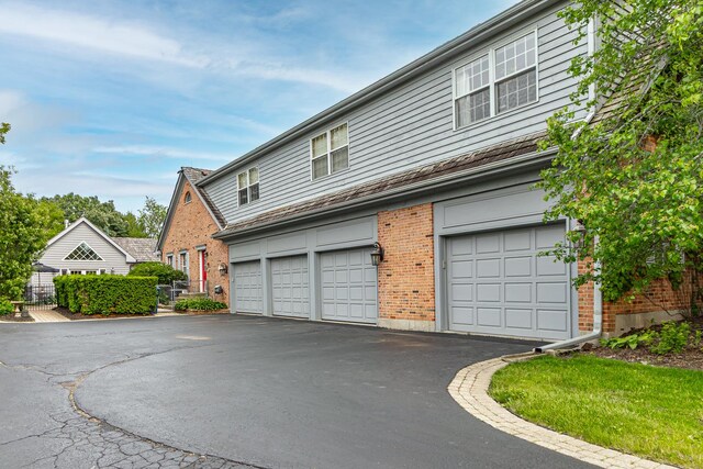 36955 N Fox Hill Dr, Wadsworth, IL 60083 - view of front of house featuring brick siding and asphalt driveway