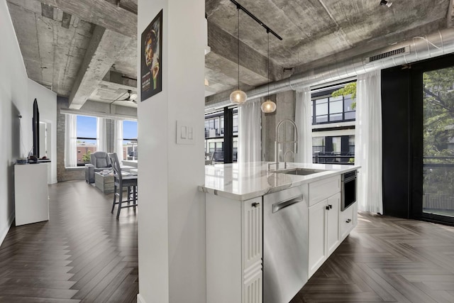 1033 W 14th Pl Unit 337, Chicago, IL 60608 - kitchen with dishwasher, a sink, white cabinets, light stone countertops, and healthy amount of natural light
