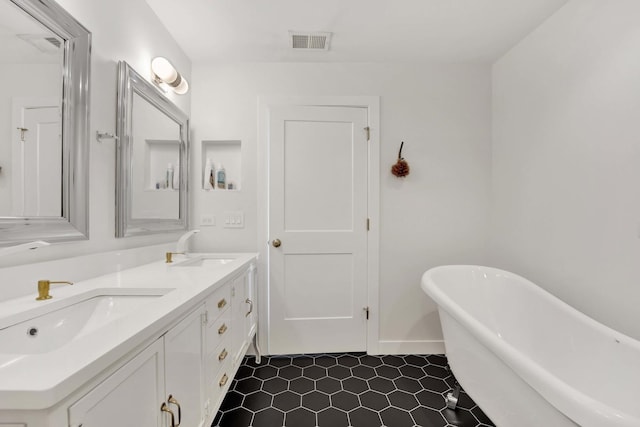1033 W 14th Pl Unit 337, Chicago, IL 60608 - full bath with a freestanding tub, double vanity, tile patterned floors, and baseboards
